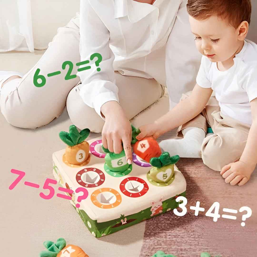 Toddler playing with Carrot Harvest counting toy — develops counting, number recognition and fine motor skills
