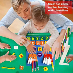 Child placing a velcro-backed '2' tile into the slot on the math learning board to practice number recognition.